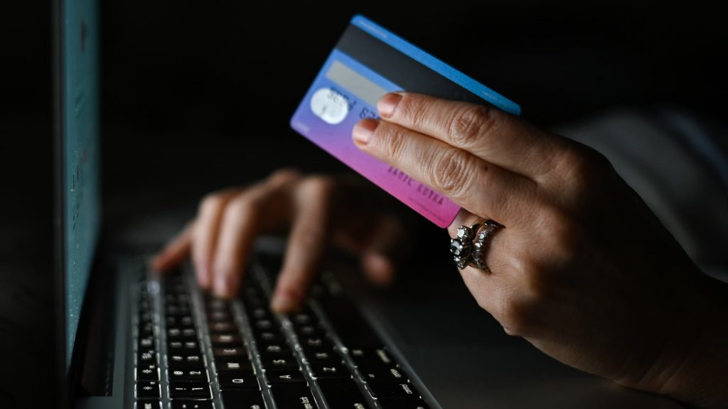 Nearly half of credit card users are carrying debt, report finds